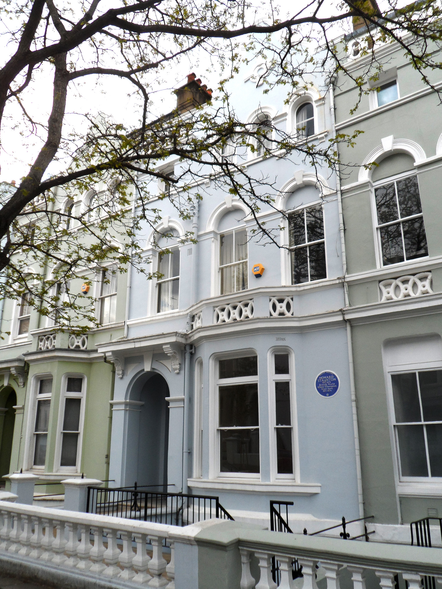 Pastel-painted Victorian townhouses on Lansdowne Road, Notting Hill